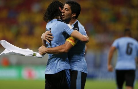 Uruguay's Luis Suarez, right, celebrates with teammate Edinson Cavani after scoring against Brazil during a 2018 World Cup qualifying soccer match at the Pernambuco Arena, in Recife, Brazil, Friday, March 25, 2016. (AP Photo/Leo Correa)