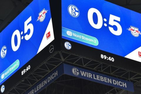 The video cube in the arena shows the 0-5 result after the German Bundesliga soccer match between FC Schalke 04 and RB Leipzig at the arena in Gelsenkirchen, Germany, Saturday, Feb. 22, 2020. (AP Photo/Martin Meissner)