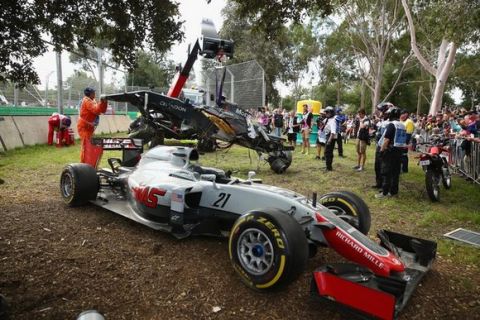 MELBOURNE, AUSTRALIA - MARCH 20: The car of Romain Grosjean of France drives the (8) Haas F1 Team Haas-Ferrari VF-16 Ferrari 059/5 turbo at the side of the track after a crash with Fernando Alonso of Spain and McLaren Honda during the Australian Formula One Grand Prix at Albert Park on March 20, 2016 in Melbourne, Australia.  (Photo by Robert Cianflone/Getty Images)