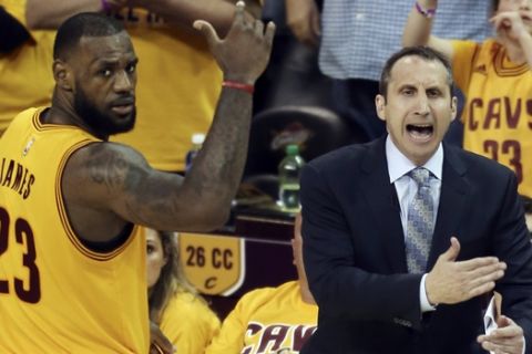 FILE - In this May 24, 2015, file photo, Cleveland Cavaliers head coach David Blatt yells at his team as LeBron James (23) looks on during overtime of Game 3 of the Eastern Conference finals of the NBA basketball playoffs against the Atlanta Hawks in Cleveland. Blatt was handed a star-studded team expected to win an NBA title, but not a handbook on how to get the Cavaliers to the top. For Blatt, who left his family in Israel to pursue his dream, the journey has been difficult with speculation about his future partly undermining his success. (AP Photo/Ron Schwane, File)