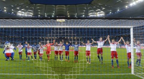 Hamburg's players celebrate after the German Bundesliga soccer match between Hamburger SV and FC Schalke 04, in Hamburg, Germany, Saturday, April 7, 2018. Hamburg defeated Schalke by 3-2.  (Axel Heimken/dpa via AP)