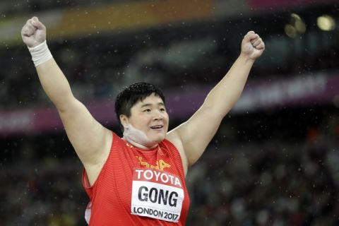 China's Gong Lijiao celebrates after winning the gold medal in the women's shot put final during the World Athletics Championships in London Wednesday, Aug. 9, 2017. (AP Photo/Matthias Schrader)