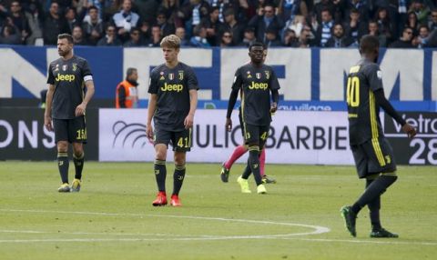 Juventus' players react after Spal's Sergio Floccari scored his side's 2nd goal during the Serie A soccer match between Spal and Juventus, at the Paolo Mazza stadium in Ferrara, Italy, Saturday, April 13, 2019. (AP Photo/Antonio Calanni)