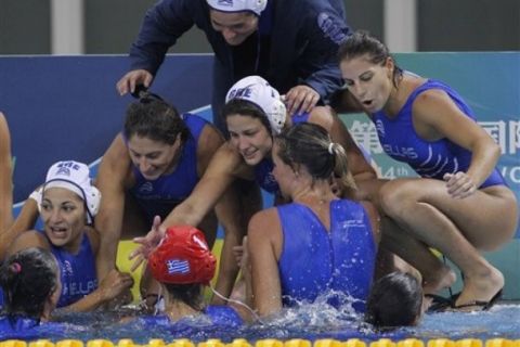 Greece's  players celebrate their victory over Netherlands after the quarter finals match in the women's water polo event at the FINA Swimming World Championships in Shanghai, China, Monday, July 25, 2011. Greece defeated Netherlands 12-10 to advance to the semi-finals. (AP Photo/Ng Han Guan)