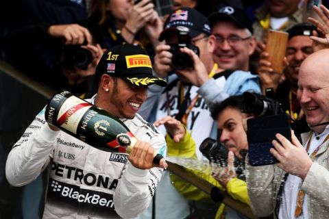 AUSTIN, TX - OCTOBER 25:  Lewis Hamilton of Great Britain and Mercedes GP celebrates after winning the United States Formula One Grand Prix and the championship at Circuit of The Americas on October 25, 2015 in Austin, United States.  (Photo by Lars Baron/Getty Images)