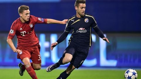 Bayern Munich's midfielder Joshua Kimmich (L) vies with Dinamo Zagreb's Portuguese defender Ivo Pinto during the UEFA Champions League football match between Dinamo Zagreb v Bayern Munich at the Maksimir stadium in Zagreb on December 9, 2015. AFP PHOTO / ANDREJ ISAKOVIC / AFP / ANDREJ ISAKOVIC        (Photo credit should read ANDREJ ISAKOVIC/AFP/Getty Images)