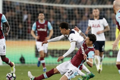 Tottenham's Dele Alli, top center, battles for the ball with West Ham's Jose Fonte during the English Premier League soccer match between West Ham United and Tottenham Hotspur at the London Stadium in London, Friday, May 5, 2017. (AP Photo/Kirsty Wigglesworth)