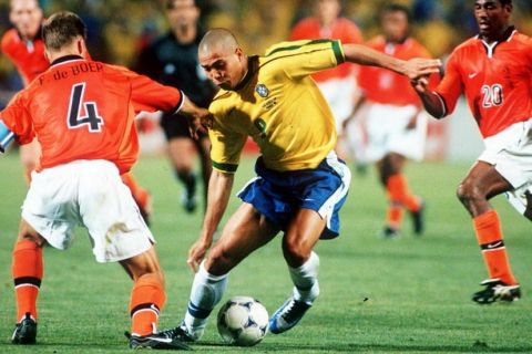 1998 World Cup Finals, Marseille, France, Semi-Final, 7th July, 1998, Brazil 1 v Holland 1, (Brazil won 4-2 on penalties), Brazil's Ronaldo takes on Holland's Frank De Boer and Aron Winter (20)  (Photo by Paul Popper/Popperfoto/Getty Images)