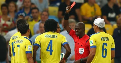 RIO DE JANEIRO, BRAZIL - JUNE 25: Antonio Valencia of Ecuador (obscured) is shown a red card by referee Noumandiez Doue during the 2014 FIFA World Cup Brazil Group E match between Ecuador and France at Maracana on June 25, 2014 in Rio de Janeiro, Brazil.  (Photo by Julian Finney/Getty Images)