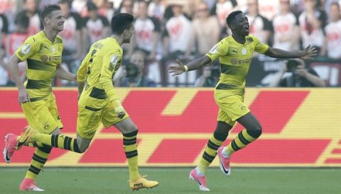 Dortmund's Ousmane Dembele, right, celebrates after scoring the opening goal during the German soccer cup final match between Borussia Dortmund and Eintracht Frankfurt in Berlin, Germany, Saturday, May 27, 2017. (AP Photo/Michael Sohn)