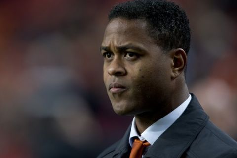 Assistant coach Patrick Kluivert of The Netherlands watches players ahead of the Group D world cup qualifying soccer match Netherlands against Estonia at ArenA stadium in Amsterdam, Netherlands, Friday March 22, 2013. (AP Photo/Peter Dejong)