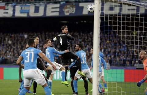 Real Madrid's Sergio Ramos, center, scores his side's first goal during the Champions League round of 16, second leg, soccer match between Napoli and Real Madrid at the San Paolo stadium in Naples, Italy, Tuesday March 7, 2017. (AP Photo/Andrew Medichini)