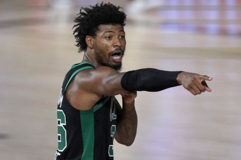 Boston Celtics' Marcus Smart (36) gestures at a Miami Heat player during the second half of an NBA conference final playoff basketball game, Tuesday, Sept. 15, 2020, in Lake Buena Vista, Fla. (AP Photo/Mark J. Terrill)