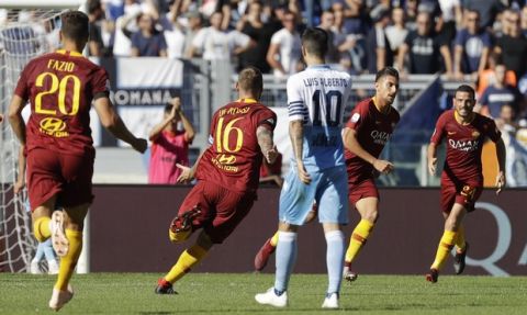 Roma's Lorenzo Pellegrini, 2nd from right, celebrates after scoring his side's opening goal during the Serie A soccer match between Roma and Lazio, at the Rome Olympic Stadium, Saturday, Sept. 29, 2018. (AP Photo/Andrew Medichini)