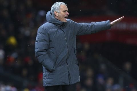 Manchester United coach Jose Mourinho gestures during the English Premier League soccer match between Manchester United and Manchester City at Old Trafford Stadium in Manchester, England, Sunday, Dec. 10, 2017. (AP Photo/Dave Thompson)