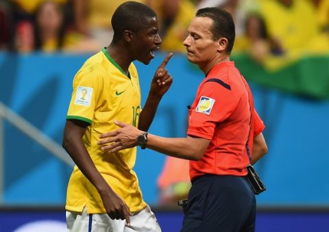BRASILIA, BRAZIL - JULY 12:  Ramires of Brazil appeals to referee Djamel Haimoudi  during the 2014 FIFA World Cup Brazil Third Place Playoff match between Brazil and the Netherlands at Estadio Nacional on July 12, 2014 in Brasilia, Brazil.  (Photo by Jamie McDonald/Getty Images)