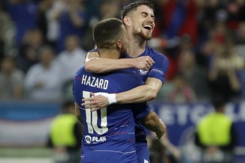 Chelsea's Eden Hazard, left, celebrates after scoring his side's third goal with his teammate Chelsea's Jorginho during the Europa League Final soccer match between Arsenal and Chelsea at the Olympic stadium in Baku, Azerbaijan, Wednesday, May 29, 2019. (AP Photo/Luca Bruno)