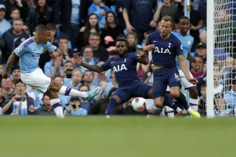 Manchester City's Gabriel Jesus, left, scores a disallowed goal during the English Premier League soccer match between Manchester City and Tottenham Hotspur at Etihad stadium in Manchester, England, Saturday, Aug. 17, 2019. (AP Photo/Rui Vieira)