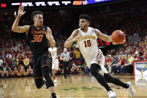 Iowa State guard Naz Mitrou-Long (15) drives to the basket past Oklahoma State guard Jeffrey Carroll (30) during the first half of an NCAA college basketball game, Tuesday, Feb. 28, 2017, in Ames, Iowa. (AP Photo/Charlie Neibergall)