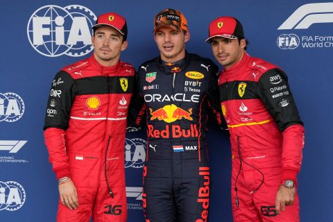 Red Bull driver Max Verstappen of the Netherlands, center, poses with Ferrari drivers Charles Leclerc, left, of Monaco and Carlos Sainz of Spain after the qualifying session of the Japanese Formula One Grand Prix at the Suzuka Circuit in Suzuka, central Japan, Saturday, Oct. 8, 2022. (AP Photo/Eugene Hoshiko)