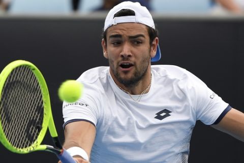 Italy's Matteo Berrettini makes a forehand return to Tennys Sandgren of the U.S. during their second round singles match at the Australian Open tennis championship in Melbourne, Australia, Wednesday, Jan. 22, 2020. (AP Photo/Andy Brownbill)