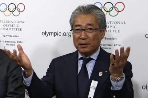 Japan's IOC member Tsunekazu Takeda, speaks, during a press conference at the 127th International Olympic Committee session in Monaco, Monday, Dec. 8, 2014. (AP Photo/Lionel Cironneau)