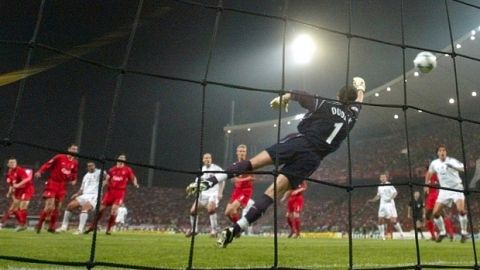 AC Milan's Paolo Maldini, 3rd left, scores his sides 1st goal past Liverpool's Jerzy Dudek during the UEFA Champions League Final between AC Milan and Liverpool at the Ataturk Olympic Stadium in Turkey, Istanbul Wednesday May 25, 2005. (AP Photo/Thomas Kienzle)