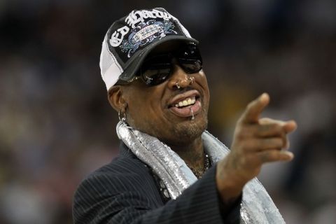 HOUSTON, TX - APRIL 04:  Naismith Memorial Basketball Hall of Fame 2011 inductee Dennis Rodman looks on during halftime of the National Championship Game of the 2011 NCAA Division I Men's Basketball Tournament at Reliant Stadium on April 4, 2011 in Houston, Texas.  (Photo by Ronald Martinez/Getty Images)