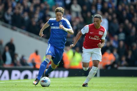 Arsenal's English striker Alex Oxlade-Chamberlain (R) chases Chelsea's Spanish striker Fernando Torres (L) during the English Premier League football match between Arsenal and Chelsea at The Emirates Stadium in north London, England on April 21, 2012. AFP PHOTO/ADRIAN DENNIS

RESTRICTED TO EDITORIAL USE. No use with unauthorized audio, video, data, fixture lists, club/league logos or live services. Online in-match use limited to 45 images, no video emulation. No use in betting, games or single club/league/player publications. (Photo credit should read ADRIAN DENNIS/AFP/Getty Images)