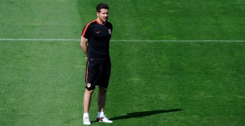 "MADRID, SPAIN - APRIL 26:  Diego Simeone, Manager of Atletico Madrid looks on during a training session ahead of the UEFA Champions League Semi-Final First Leg between Club Atletico de Madrid and Bayern Meunchen at Majadahonda training ground on April 26, 2016 in Madrid, Spain.  (Photo by Denis Doyle/Getty Images)"