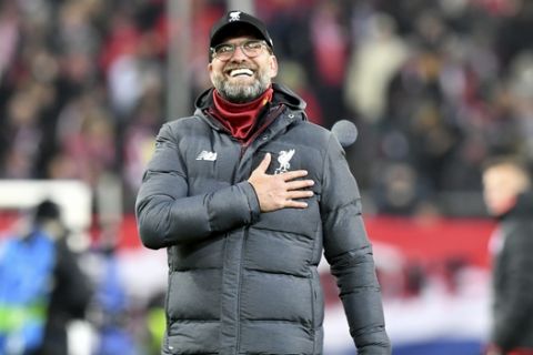 Liverpool's manager Jurgen Klopp celebrates at the end of the group E Champions League soccer match between Salzburg and Liverpool, in Salzburg, Austria, Tuesday, Dec. 10, 2019. Liverpool won 2:0. (AP Photo/Kerstin Joensson)