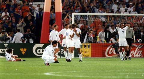 Italy soccer team players leave the field in dejection after the final game of the European soccer Championships, on July 2, 2000 in Rotterdam, the Netherlands. France defeated Italy 2-1 in extra time to win the Championship. (Ap Photo/Carlo Fumagalli)