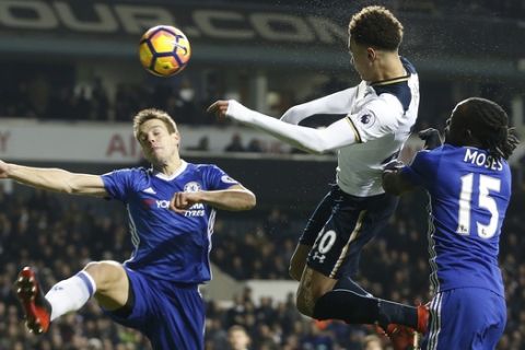 Tottenham's Dele Alli, centre, scores a goal during the English Premier League soccer match between Tottenham Hotspur and Chelsea at White Hart Lane stadium in London, Wednesday, Jan. 4, 2017. (AP Photo/Alastair Grant)