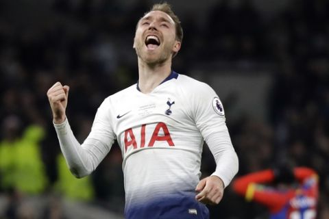 Tottenham's Christian Eriksen celebrates after scoring his side's second goal during the English Premier League soccer match betweenTottenham Hotspur and Crystal Palace, the first Premiership match at the new Tottenham Hotspur stadium in London, Wednesday, April 3, 2019. (AP Photo/Kirsty Wigglesworth)