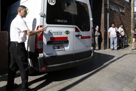 A vehicle carrying the remains of Emiliano Sala arrives in Santa Fe, Argentina, Friday, Feb. 15, 2019. The Argentina-born forward died in an airplane crash in the English Channel last month when flying from Nantes in France to start his new career with English Premier League club Cardiff. (AP Photo/Natacha Pisarenko)