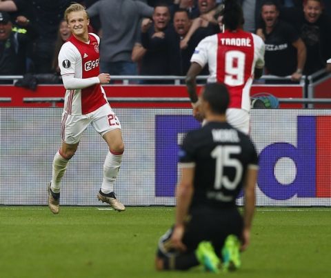 Ajax's Kasper Dolberg, left, celebrates after scoring the second of his team during the first leg semi final soccer match between Ajax and Olympique Lyon in the Amsterdam ArenA stadium, Netherlands, Wednesday, May 3, 2017. (AP Photo/Peter Dejong)