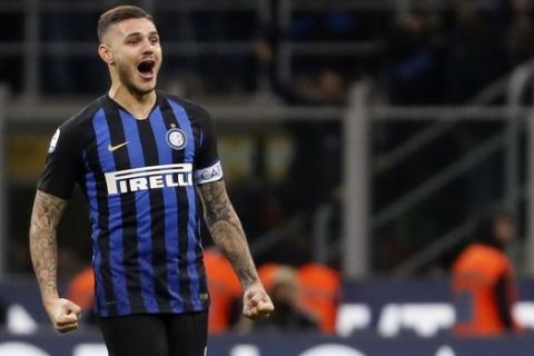 Inter Milan's Mauro Icardi celebrates after scoring during the Serie A soccer match between Inter Milan and AC Milan at the San Siro Stadium, in Milan, Italy, Sunday, Oct. 21, 2018. Mauro Icardi's stoppage-time header gave Inter Milan a 1-0 win over AC Milan in the city derby on Sunday. (AP Photo/Antonio Calanni)