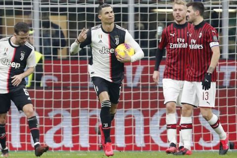 Juventus' Cristiano Ronaldo, second from left, celebrates after scoring his side's opening goal during an Italian Cup quarter final soccer match between AC Milan and Juventus at the San Siro stadium, in Milan, Italy, Thursday, Feb. 13, 2020. (AP Photo/Antonio Calanni)
