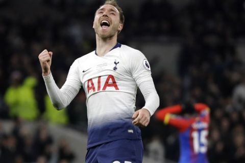 Tottenham's Christian Eriksen celebrates after scoring his side's second goal during the English Premier League soccer match betweenTottenham Hotspur and Crystal Palace, the first Premiership match at the new Tottenham Hotspur stadium in London, Wednesday, April 3, 2019. (AP Photo/Kirsty Wigglesworth)