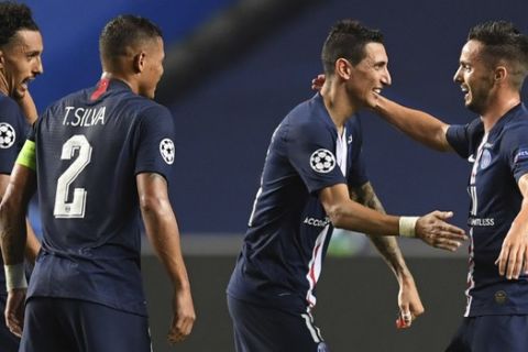PSG's Angel Di Maria, second from right, celebrates with team mates at the Champions League semifinal soccer match between RB Leipzig and Paris Saint-Germain at the Luz stadium in Lisbon, Portugal, Tuesday, Aug. 18, 2020. (David Ramos/Pool Photo via AP)