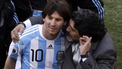 Argentina head coach Diego Maradona, right, and Argentina's Lionel Messi, left walk off the pitch after  the World Cup group B soccer match between Argentina and South Korea at Soccer City in Johannesburg, South Africa, Thursday, June 17, 2010. Argentina won 4-1.  (AP Photo/Marcio Jose Sanchez)