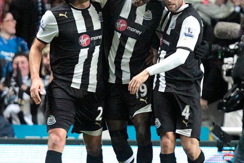 Newcastle United's Senegalese striker Demba Ba (C) celebrates scoring their first goal against Manchester United with Argentinian defender Fabricio Coloccini (L) and French midfielder Yohan Cabaye during an English FA Premier League football match at St James' Park, Newcastle upon Tyne, England, on January 4, 2012. AFP PHOTO/ GRAHAM STUART - FOR EDITORIAL USE 

RESTRICTED TO EDITORIAL USE. No use with unauthorized audio, video, data, fixture lists, club/league logos or "live" services. Online in-match use limited to 45 images, no video emulation. No use in betting, games or single club/league/player publications. (Photo credit should read GRAHAM STUART/AFP/Getty Images)