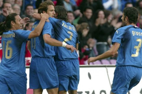 From left, Italy's Mauro Camoranesi, Alberto Gilardino, Christian Zaccardo and Fabio Grosso celebrate after Alberto Gilardino scored the first goal against Switzerland during a friendly soccer match in preparation for the upcoming Soccer World Cup between Italy and Switzerland at the Stade de Geneve, in Geneva, Switzerland, Wednesday, May 31, 2006. Italy will play in Group E against Ghana, USA and Czech Republic. Switzerland will play in group G with France, Republic of Korea and Togo. (AP Photo/Nicholas Ratzenboeck)