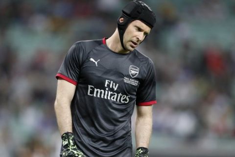 Arsenal goalkeeper Petr Cech walks on the pitch during warmup before the Europa League Final soccer match between Chelsea and Arsenal at the Olympic stadium in Baku, Azerbaijan, Wednesday, May 29, 2019. (AP Photo/Darko Bandic)