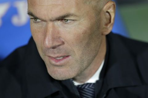 Real Madrid's coach Zinedine Zidane stands on the touchline before a Spanish La Liga soccer match between Getafe and Real Madrid at the Alfonso Perez stadium in Getafe, Spain, Thursday, April 25, 2019. (AP Photo/Bernat Armangue)
