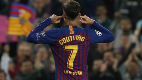 Barcelona forward Philippe Coutinho gestures after scoring his side's third goal during the Champions League quarterfinal, second leg, soccer match between FC Barcelona and Manchester United at the Camp Nou stadium in Barcelona, Spain, Tuesday, April 16, 2019. (AP Photo/Joan Monfort)