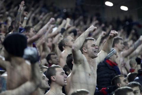 CSKA Moscow's fans cheer on their team during the Champions League Group E soccer match between CSKA Moscow and Monaco in Moscow, Russia, Tuesday, Oct. 18, 2016. (AP Photo/Pavel Golovkin)