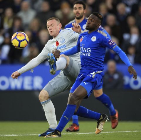 Leicester City's Wilfred Ndidi, right, and Everton's Wayne Rooney battle for the ball during their English Premier League soccer match at the King Power Stadium in Leicester, England, Sunday Oct. 29, 2017. (Mike Egerton/PA via AP)