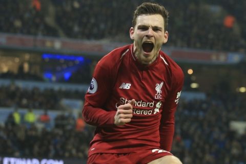 Liverpool's Andrew Robertson celebrates after his teammate Liverpool's Roberto Firmino scored his sides 1st goal during their English Premier League soccer match between Manchester City and Liverpool at the Ethiad stadium, Manchester England, Thursday, Jan. 3, 2019. (AP Photo/Jon Super)