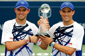 TORONTO, ON - AUGUST 15:  Bob and Mike Bryan of the United States pose for photographers after defeatinf Michael llodra and Julien Benneteau of France in the doubles during the final of the Rogers Cup at the Rexall Centre on August 15, 2010 in Toronto, Canada.  (Photo by Matthew Stockman/Getty Images)